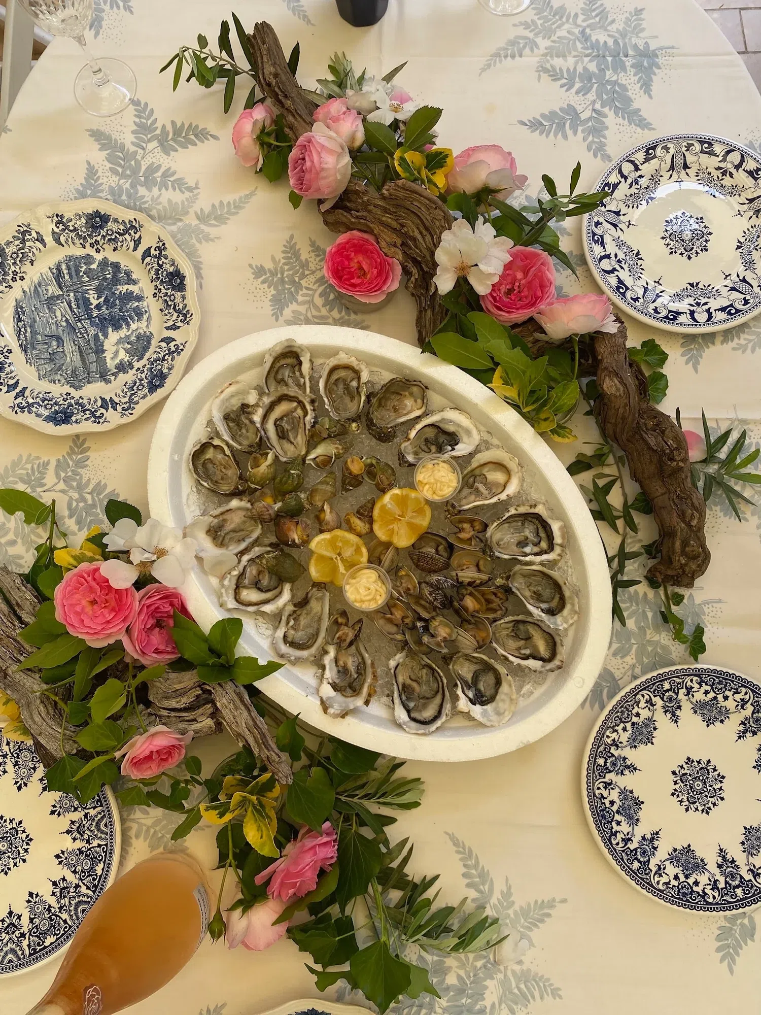 Oysters and shellfish on ice at a set table